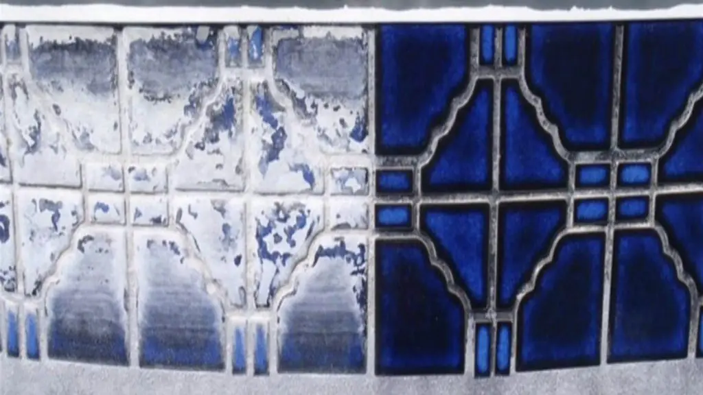 Patterned cobalt pool tile, white calcium crust on the left half and clean glaze on the right